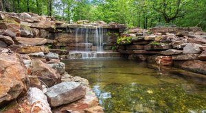 A Tropical-Inspired Getaway In Oklahoma, This Cabin In Broken Bow Has A Private Waterfall